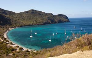 CF1B2E Sail boats are moored in the well protected Chatham Bay on Union Island.